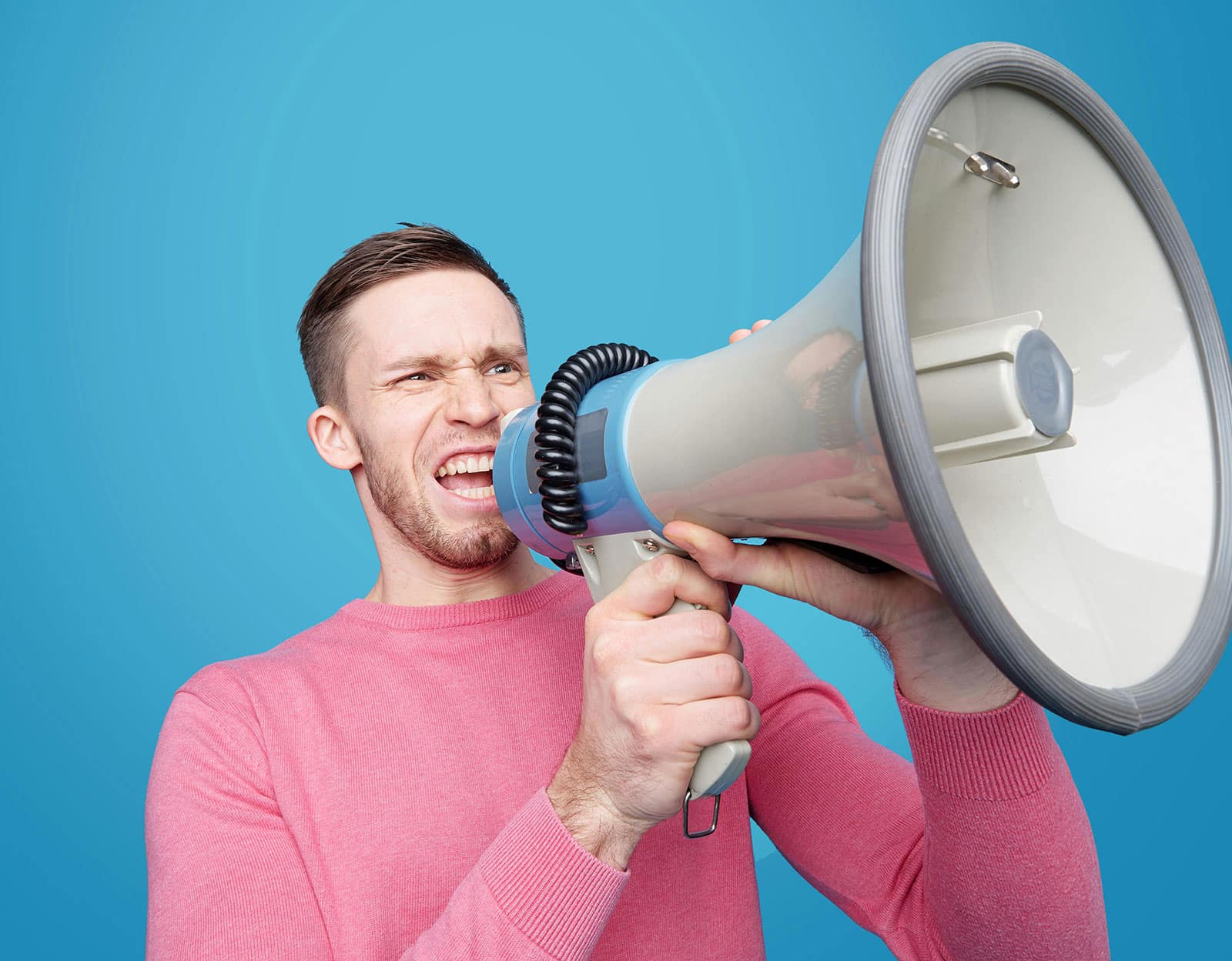 An image of a person with an exaggerated bullhorn to represent the email blasts as just noise versus customer journeys as informed ways to build trust and grow sales.