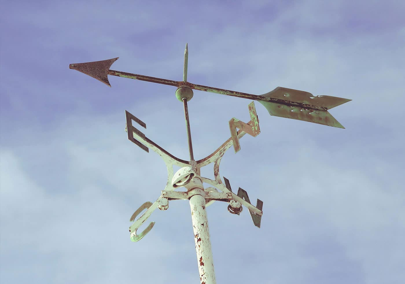 A photo of a weather vane to represent marketing as an input to the conditions in the market to make better business decisions.