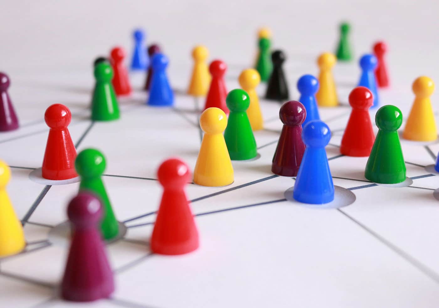 Images of connected but different colored game pieces to represent the idea of different marketing customer segments.